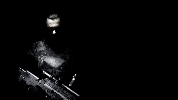 The Punisher with a weapon on a black background