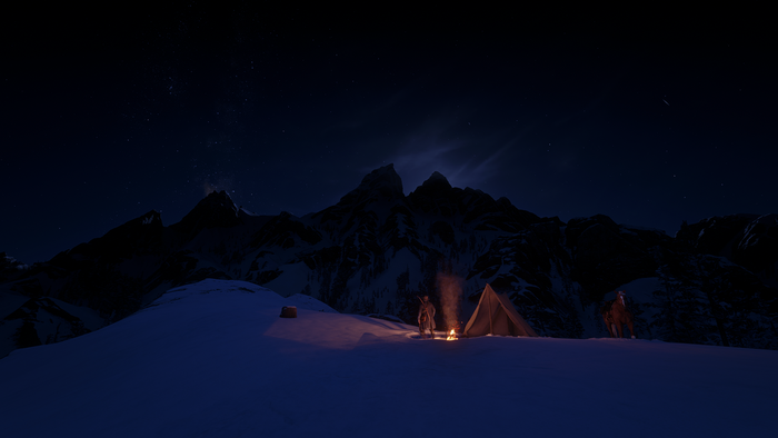 Man camping in snowy mountains at night in Red Dead Redemption 2