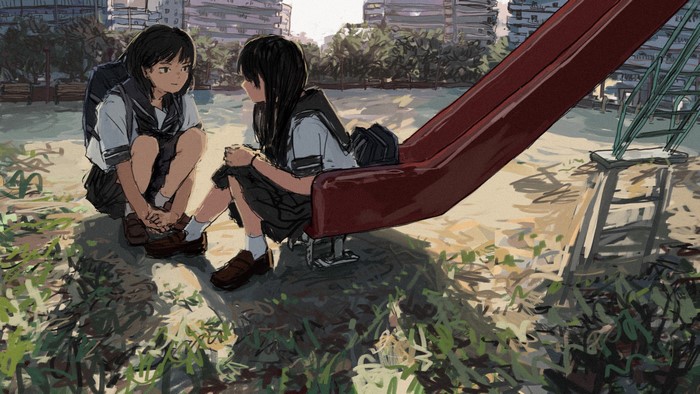 Two schoolgirls in uniform sitting by a slide