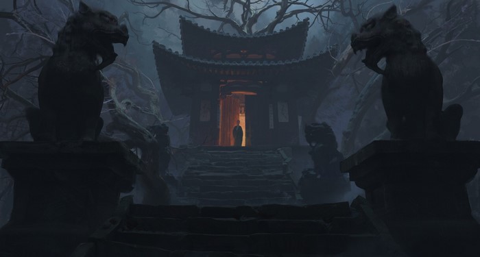 Person standing at entrance of dark Asian temple with statues