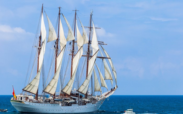 Sailing ship with full sails on the sea