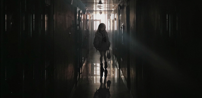 Anime girl walking down a dark hallway