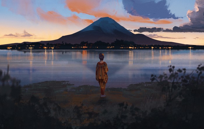 Woman in Japanese clothes by Mount Fuji at sunset