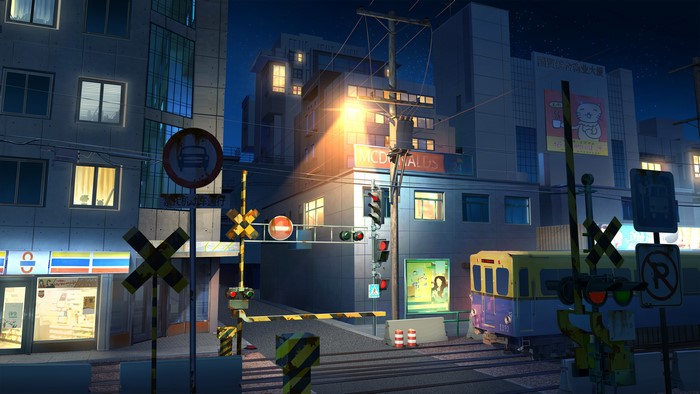 Night train crossing with McDonald's and convenience store