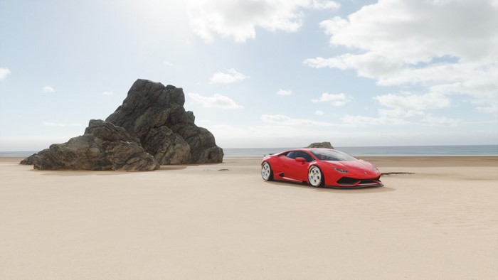 Red Lamborghini on a sandy beach with rocks