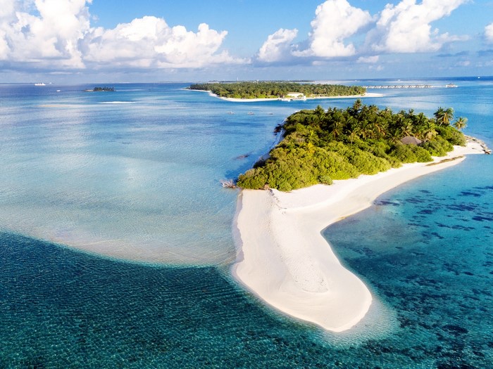 Tropical island with white sand beach and turquoise water