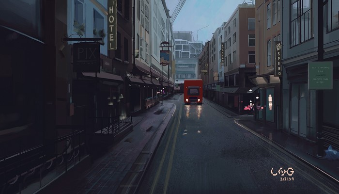 Red truck driving down a wet city street at dusk