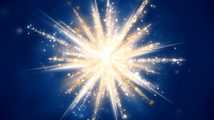 Abstract golden explosion with light streaks