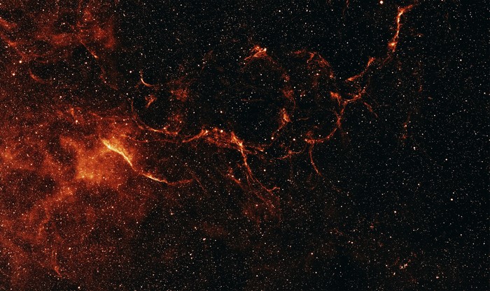 Orange nebula and stars in deep space