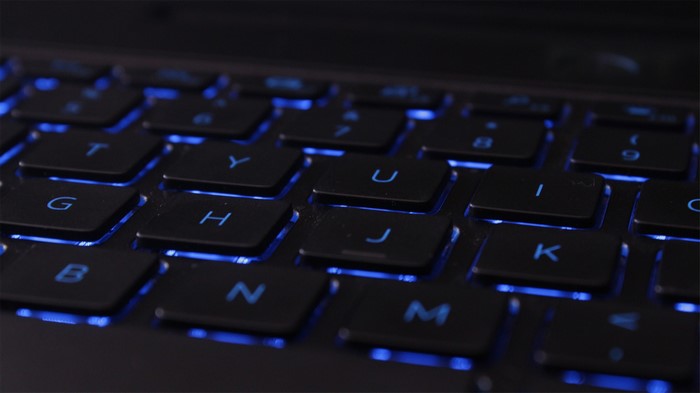 Close-up of a backlit QWERTY keyboard
