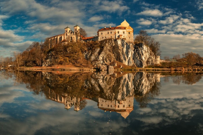 Benedictine Abbey on a cliff overlooking a lake in Poland