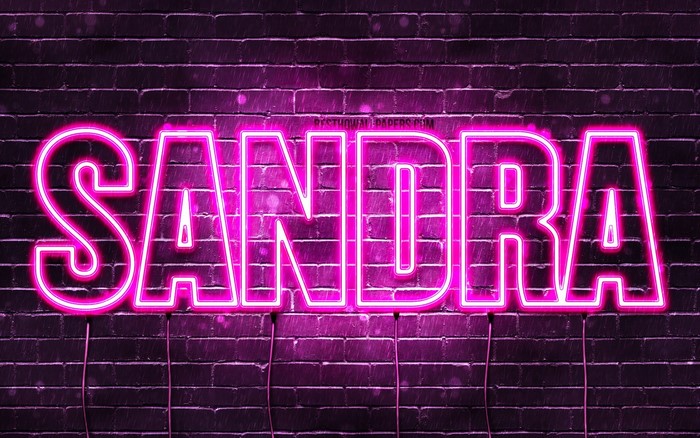 Sandra neon sign on brick wall