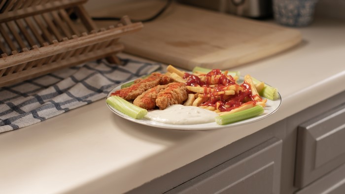 Chicken tenders with fries, celery, and dip