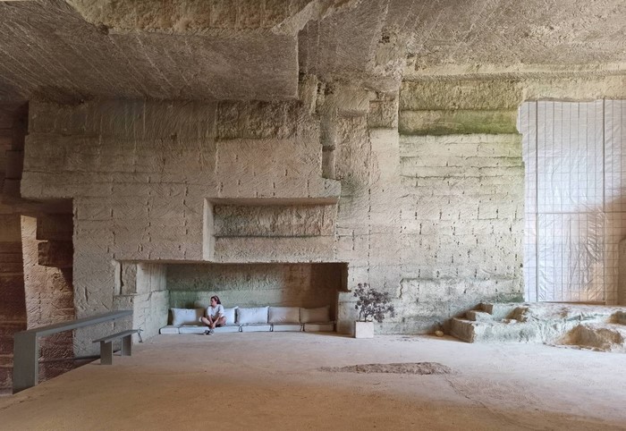 Interior of a carved stone structure with seating