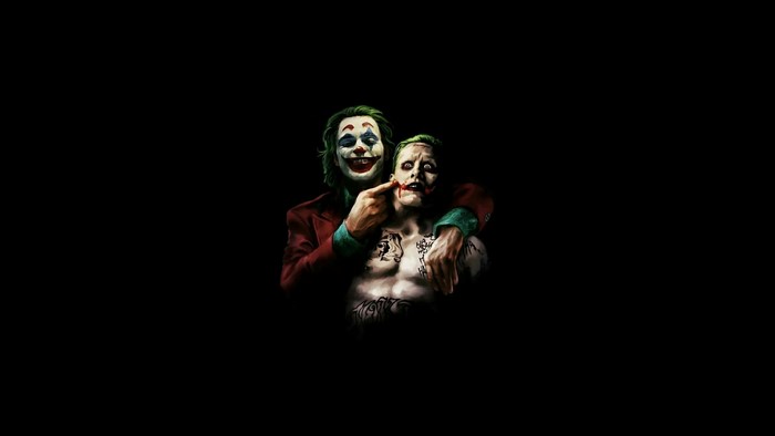 Two Jokers, one pointing at the other's face