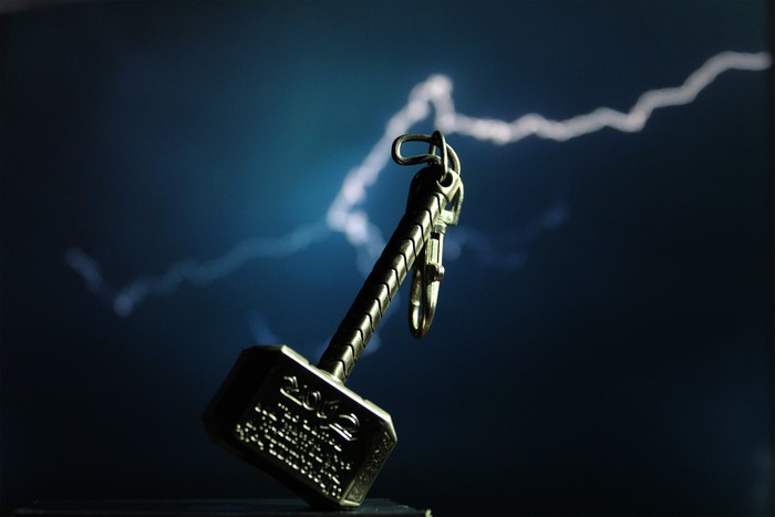 Thor's Mjolnir keychain with lightning background