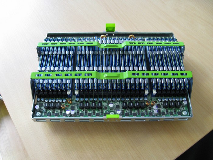 Server motherboard with RAM modules and green plastic clips