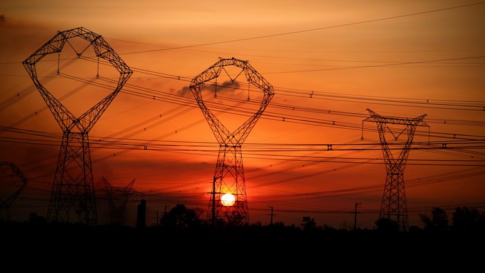 Power lines and towers at sunset