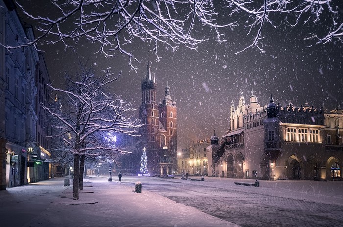 Krakow's Old Town Square during a snowy night