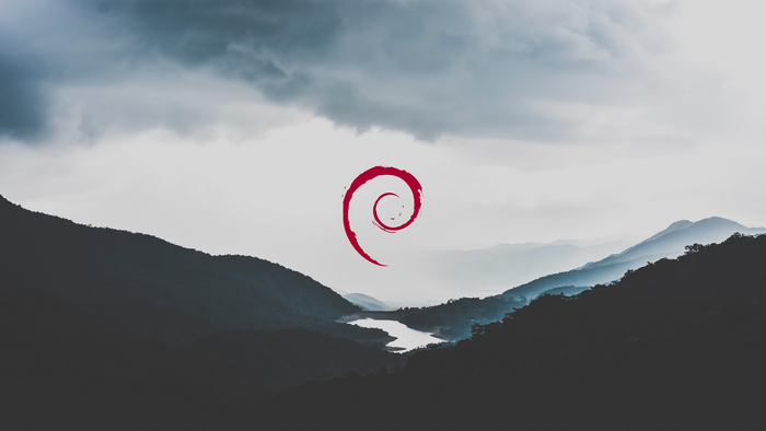 Debian logo over misty mountains and lake