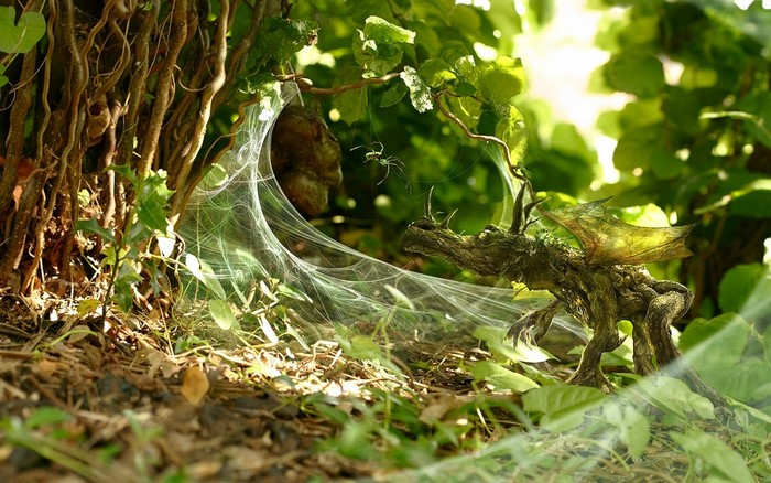 Dragon in a spider web in a forest