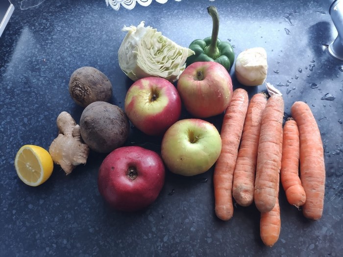 Assortment of fresh fruits and vegetables on a countertop