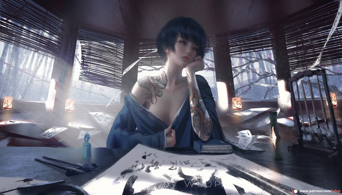 Woman with tattoos sitting indoors by a window