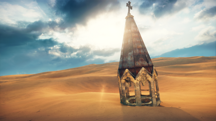 Ruined church spire in a desert landscape