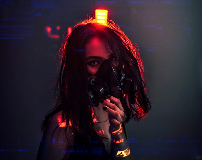 Cyberpunk woman with mask and red light