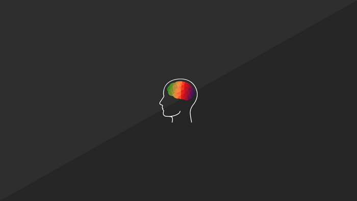 Minimalist outline of a head with a colorful polygonal brain