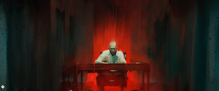 Man sitting at a table in a red room