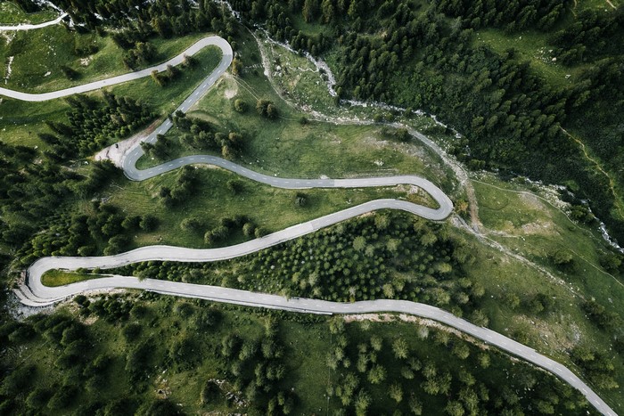 Aerial view of a winding mountain road in the Swiss Alps