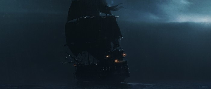 A dark ship sails on the sea at night