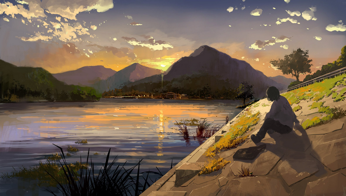 Sunset over a lake with mountains and a person sitting
