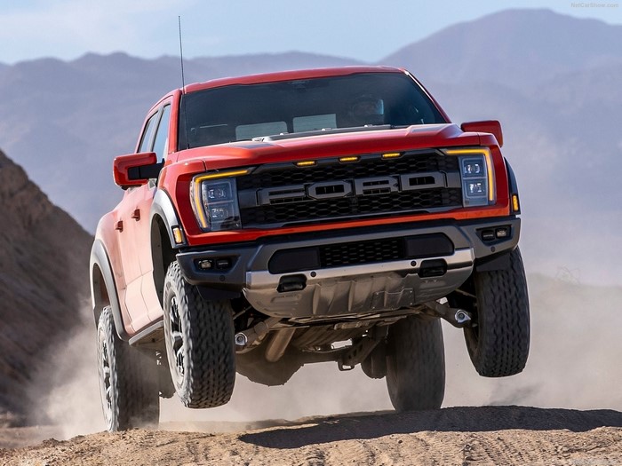 2021 Ford F-150 Raptor pickup truck driving off-road