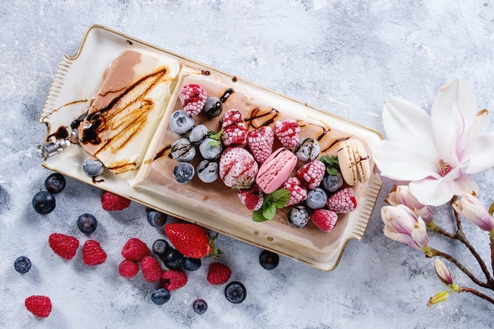 Chocolate and vanilla ice cream cake with berries and macarons