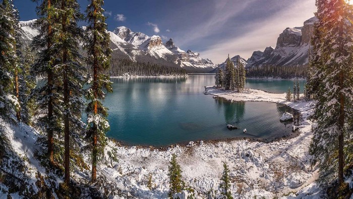 Snowy landscape with a lake and mountains