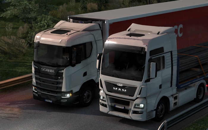 Two trucks, Scania and MAN, on a road