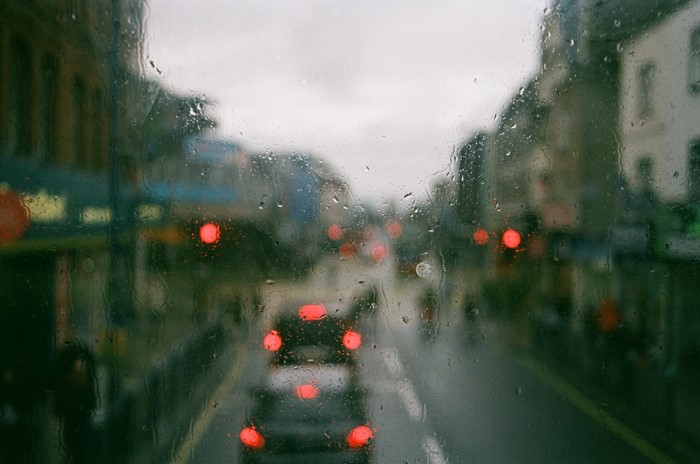 Rainy city street with bokeh lights