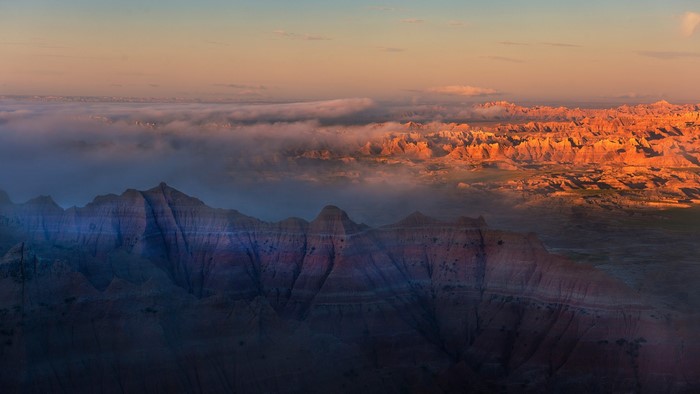 Badlands National Park at sunrise with fog