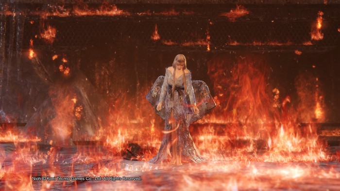 Woman in a dress surrounded by fire in Nioh
