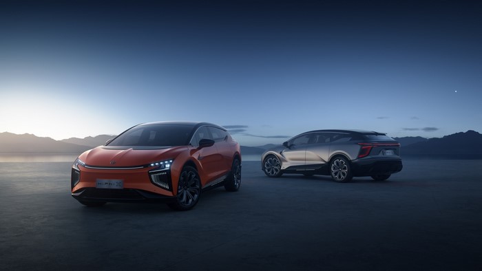 Two HiPhi electric cars on a plain at dusk