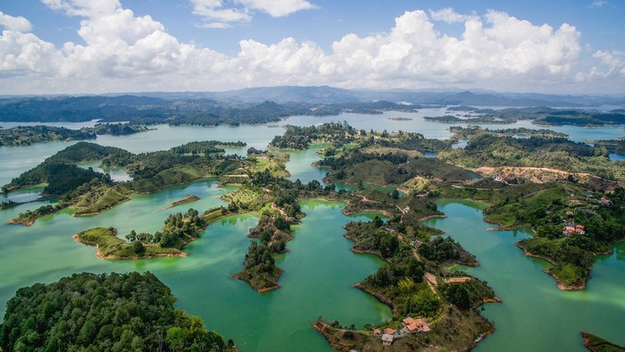 Aerial View of Serene Water and Lush Landscape