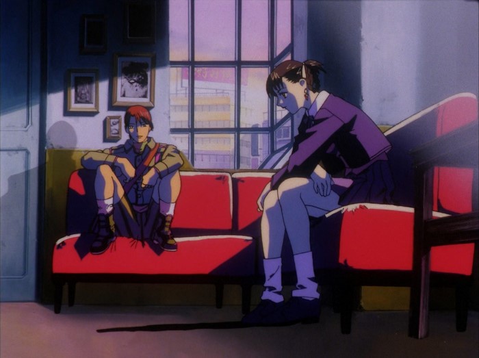 Two anime characters sitting on a couch