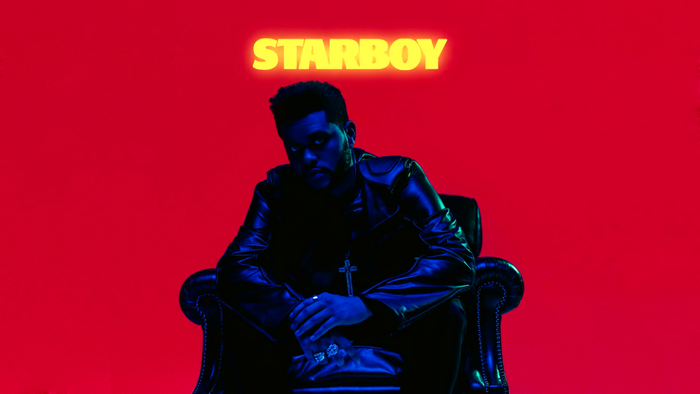 The Weeknd as Starboy sitting in a chair