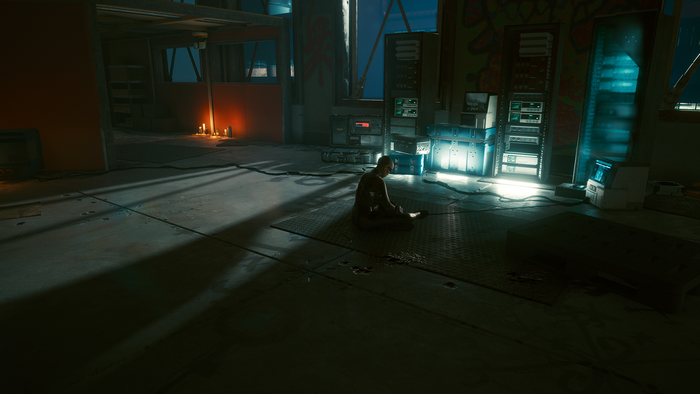 Cyberpunk 2077 screenshot of a person meditating