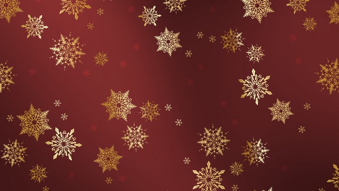 Golden snowflakes on a red background