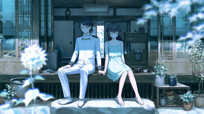 Man in uniform and woman in sun dress holding hands