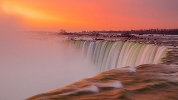 Niagara Falls at sunset with mist