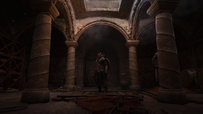 Eivor from Assassin's Creed Valhalla in a stone chamber